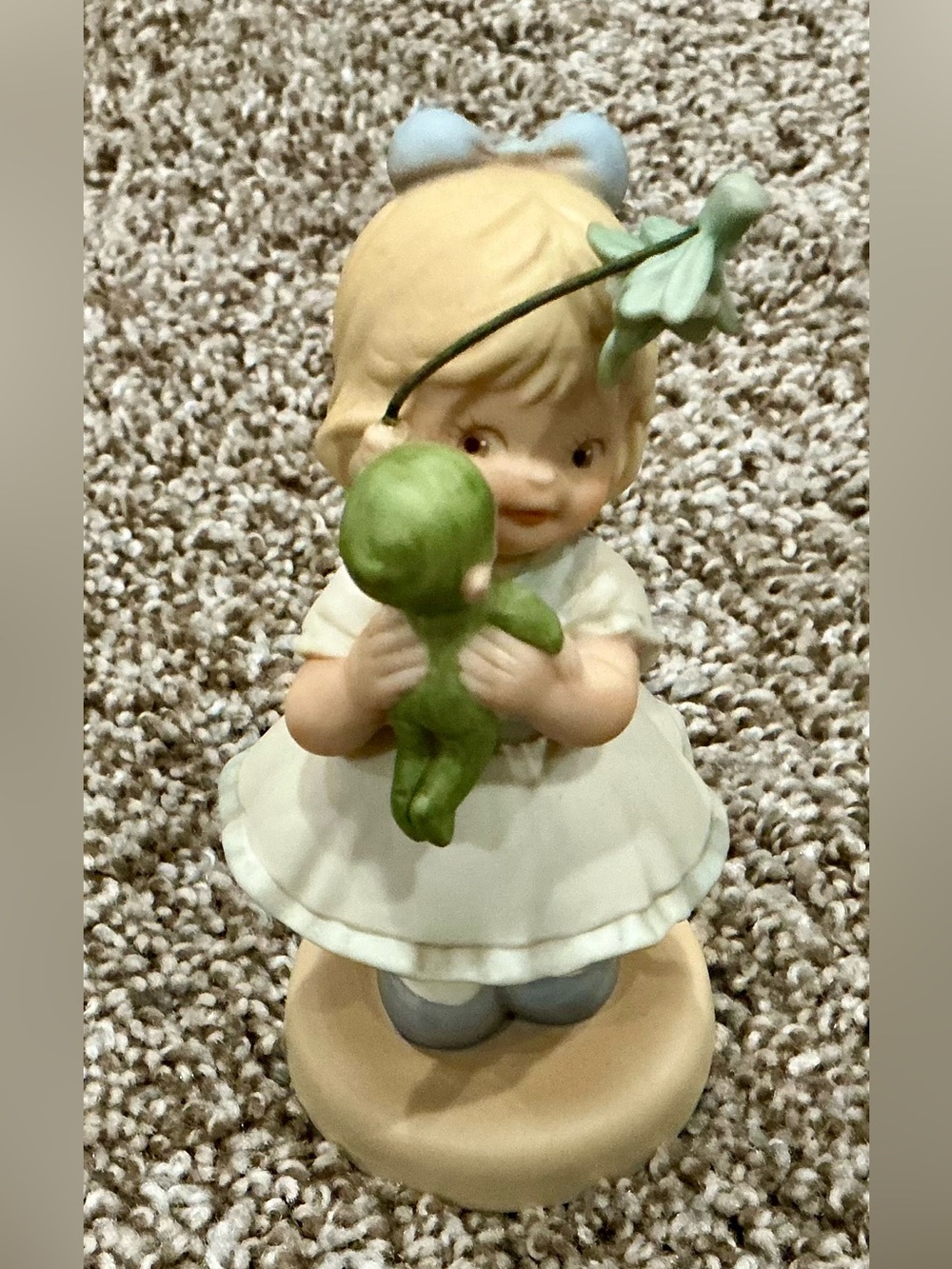 Memories of yesterday/Blue-Accented Girl Figurine Holding Green Doll